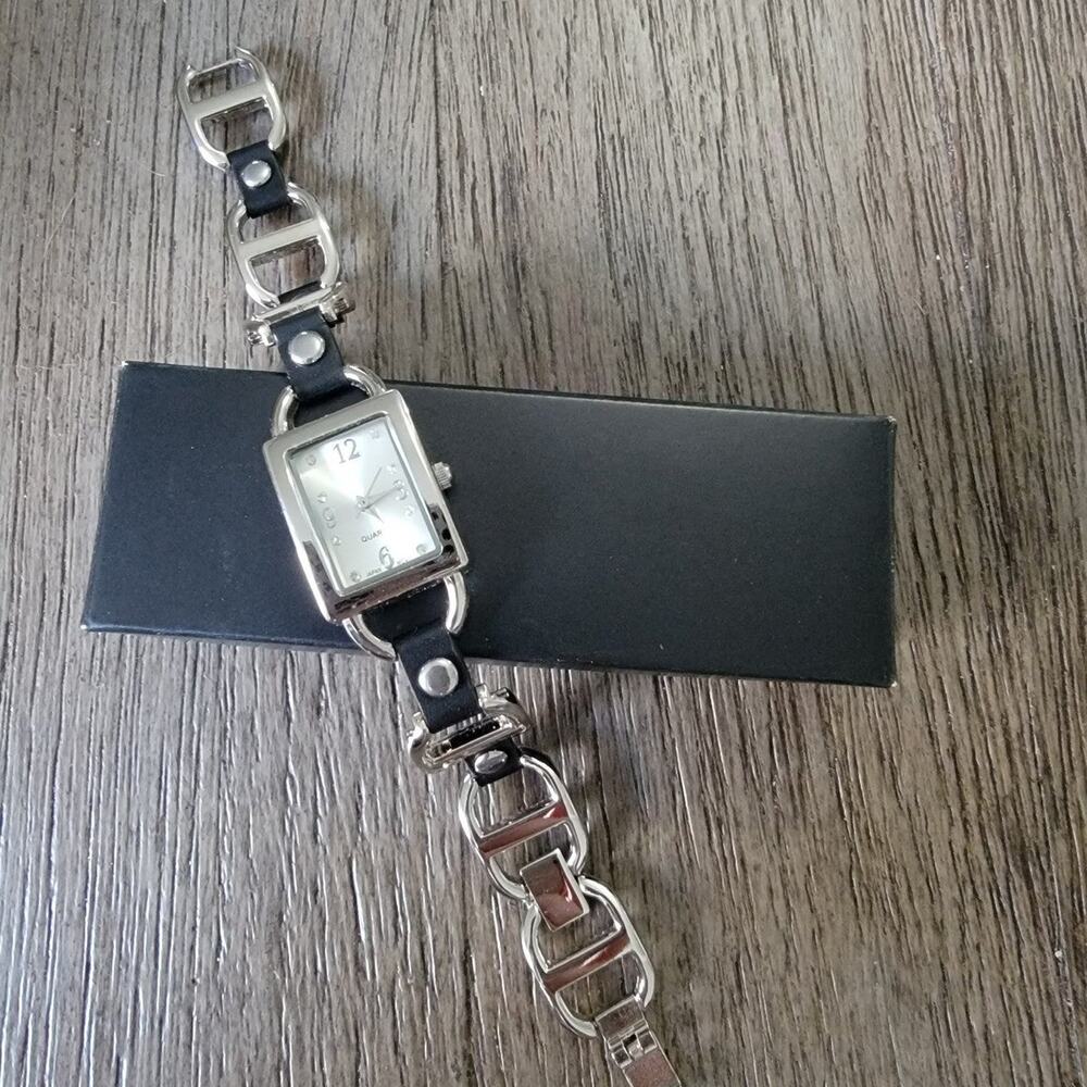 Avon silver and black watch